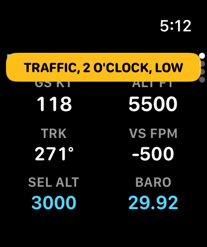 A traffic alert as an amber banner over the FLY page